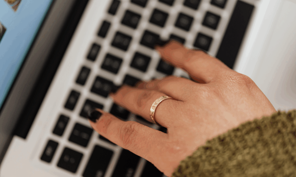 Digital assets blog - hands typing on a laptop